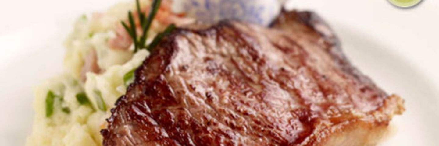 Striploin Steaks on Smoked Bacon Champ