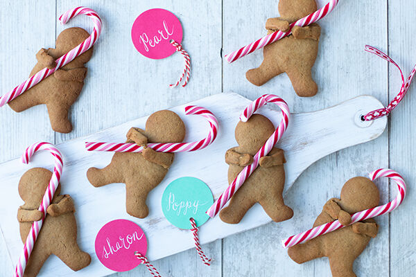 Cuddling candy cane gingerbread men